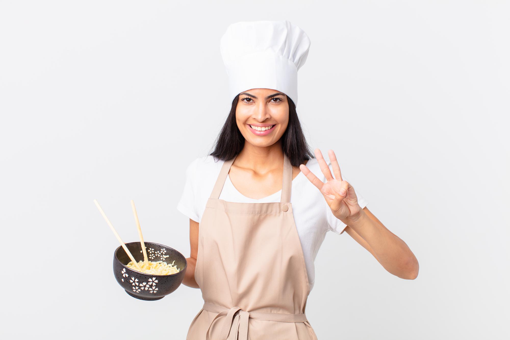 Participant smiling while cooking